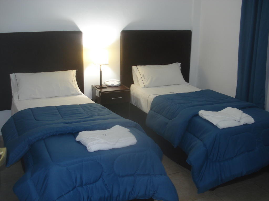 Morada Suites Campana Phòng bức ảnh